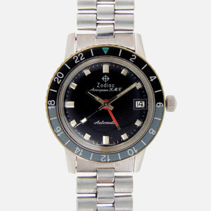 1960s Zodiac Aerospace GMT Vintage Automatic Movement Ref. 752-834B with glossy black dial and bi-directional bezel in stainless steel for sale on Vintage Watch Leader Professional Dealer